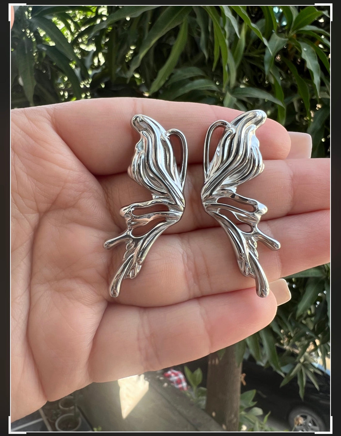 Chrome heart butterfly earrings