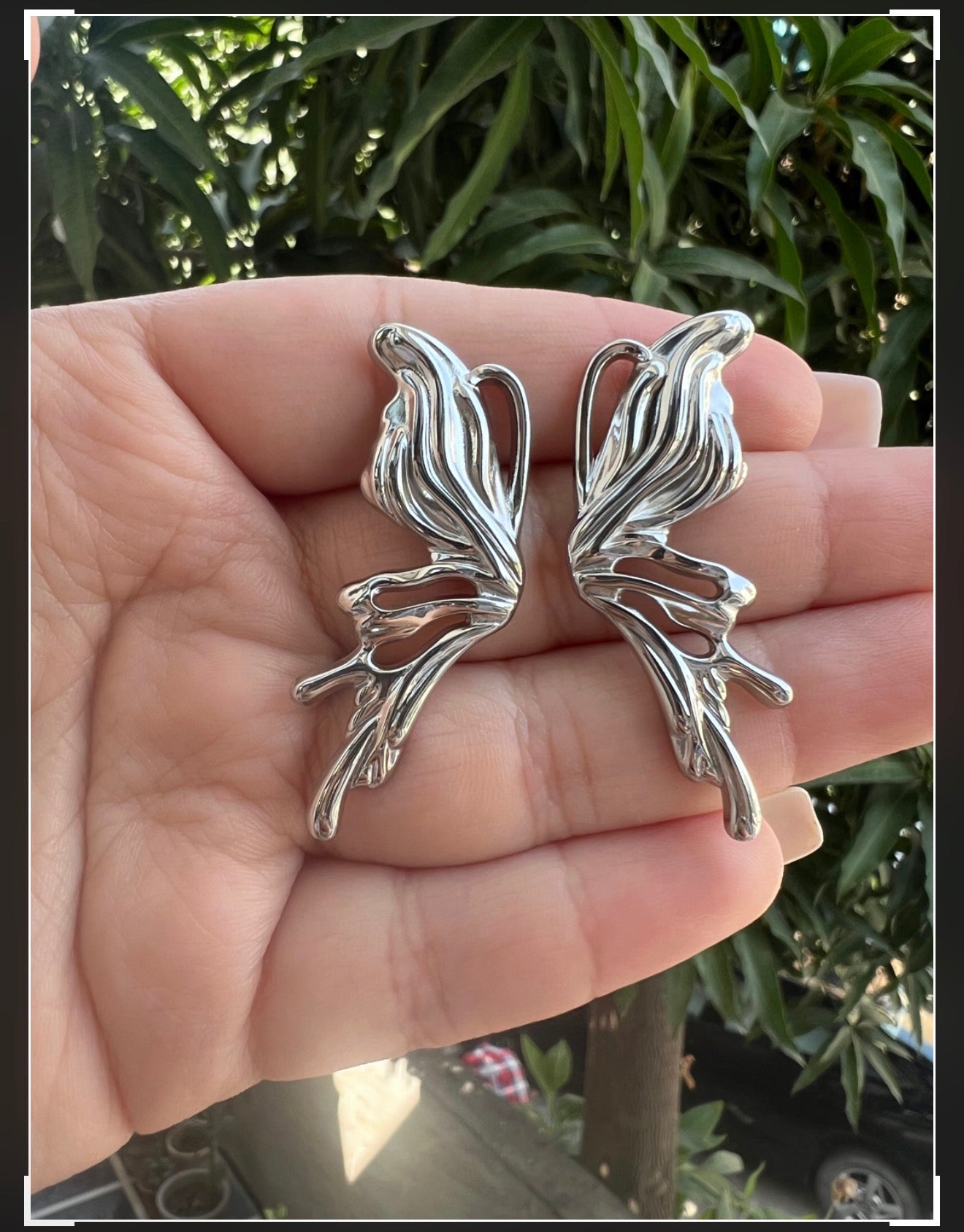 Chrome heart butterfly earrings