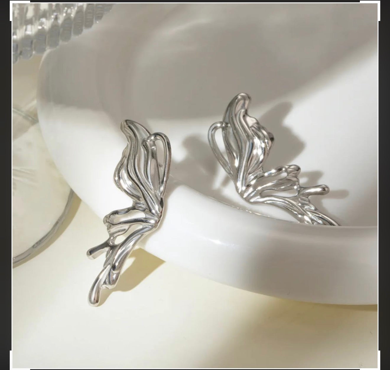 Chrome heart butterfly earrings