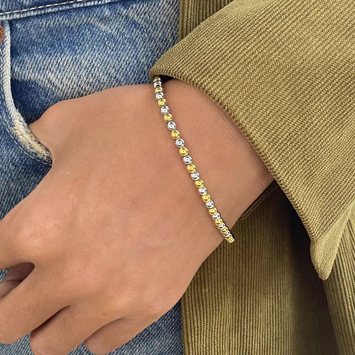 Mixed metal elastic bracelet